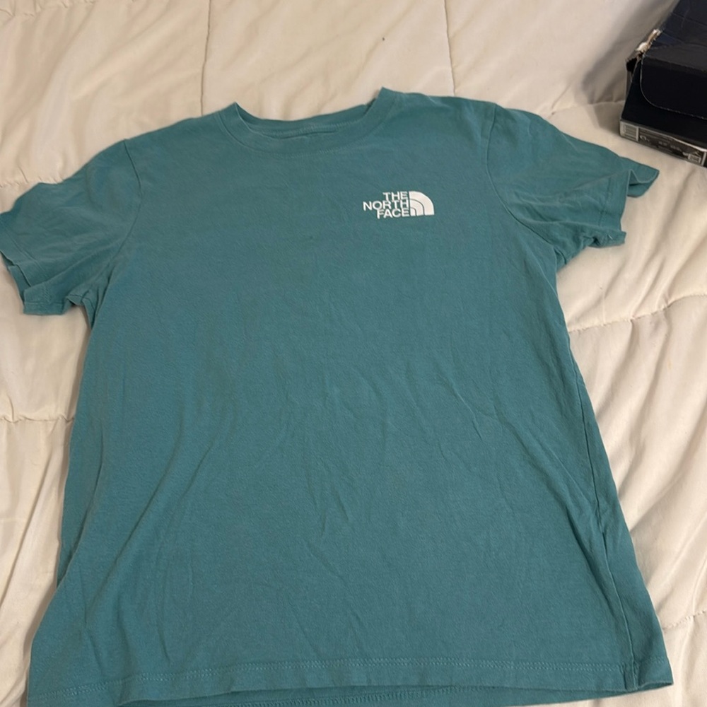 Teal short sleeve north face shirt. Can iron before shipping out.